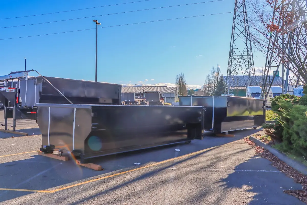Roll-off dumpster ready for waste disposal at job site for 2 Yard Dumpster Rental in Fruitport